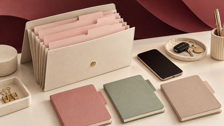 Organized document folder, notebooks, phone and keys illustrating BBL planning and everyday coordination